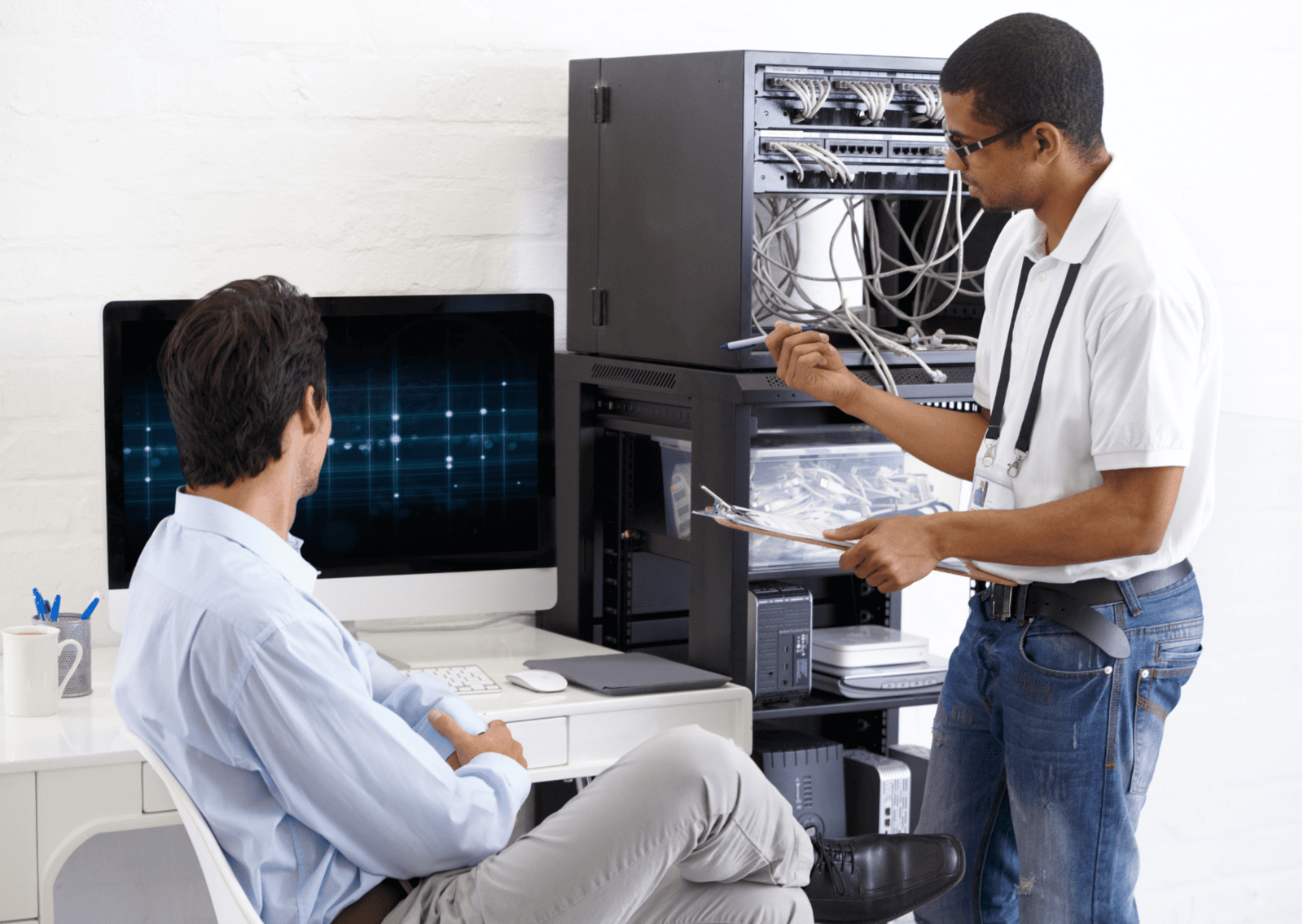 IT technicians discussing screen